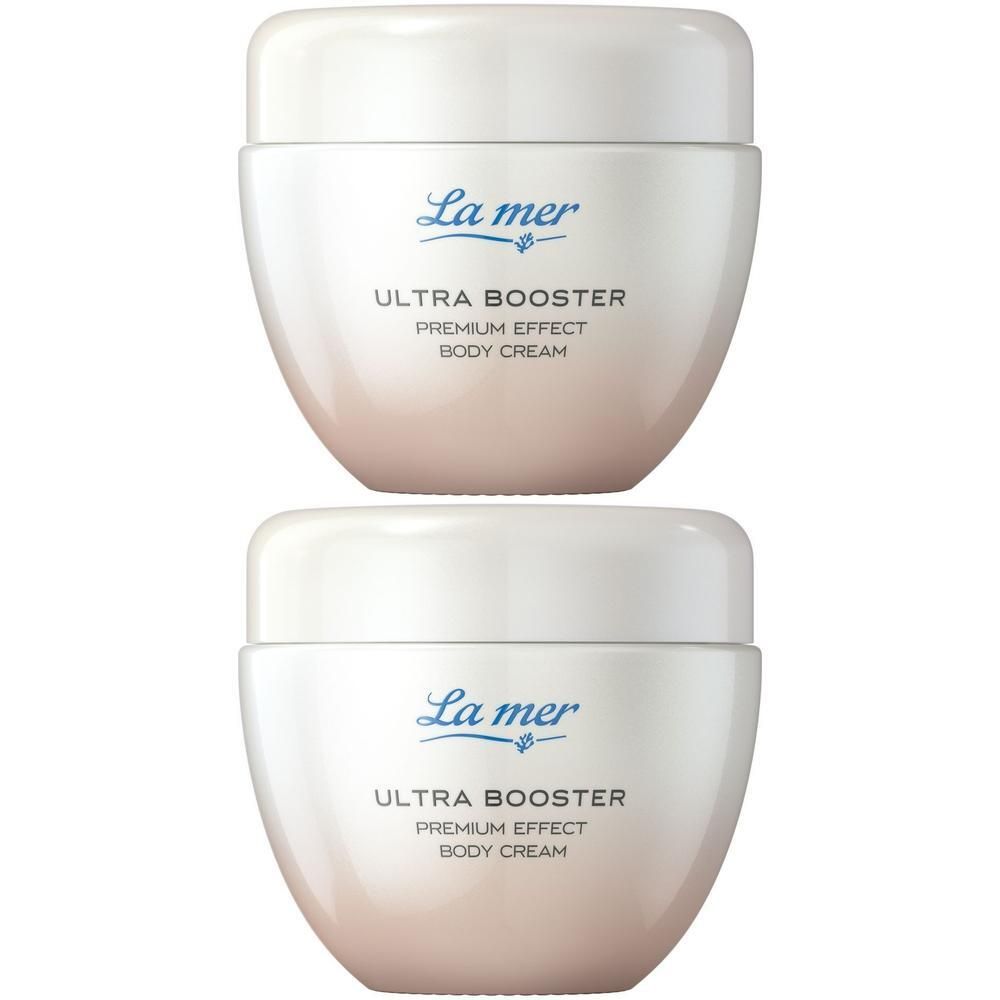 Zwei cremefarbene Tiegel mit weißem Deckel. Aufschrift: La mer, Ultra Booster, Premium Effect, Body Cream.