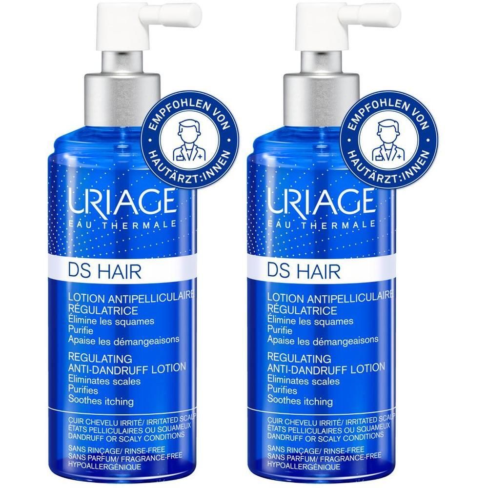 Zwei blaue Flaschen mit weißem Dosierkopf. Aufschrift: URIAGE DS HAIR. Empfohlen von Hautärzt:innen.