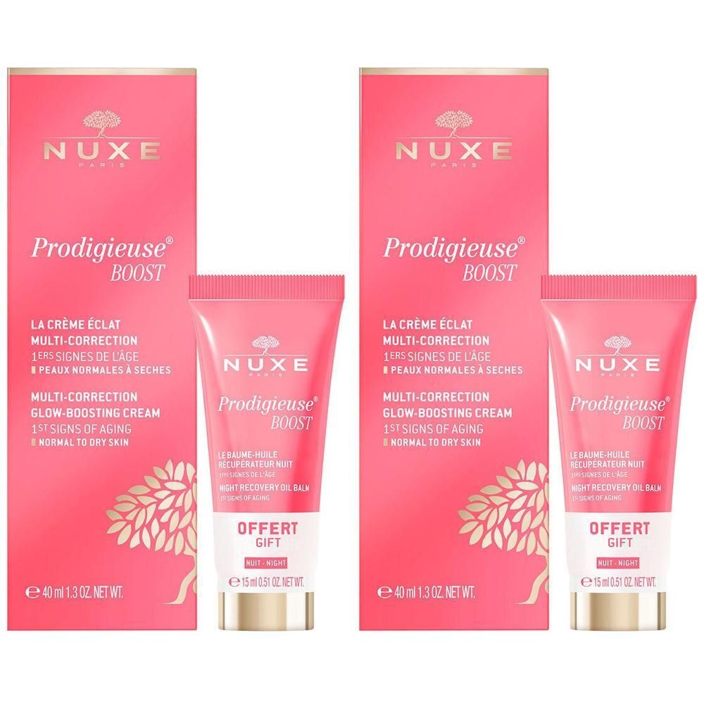 Zwei rosa Verpackungen und Tuben. Aufschrift: NUXE Prodigieuse Boost. Enthält Creme und Nacht-Ölbalsam. Aufschrift: Offert Gift.