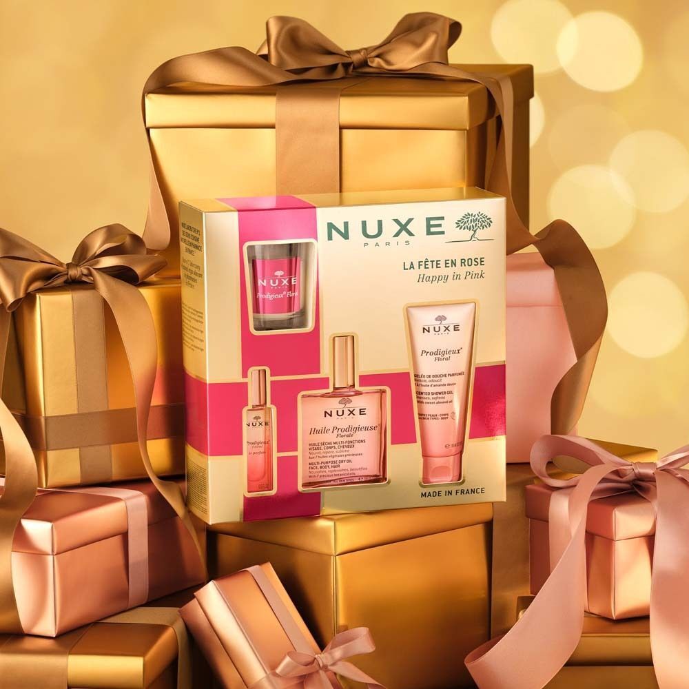 Geschenkset mit mehreren Produkten. Enthält Flakons und Tuben in rosa. Aufschrift: NUXE, La Fête en Rose, Happy in Pink.