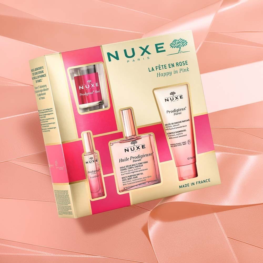 Geschenkset mit mehreren Produkten. Enthält Flakons und Tuben in rosa. Aufschrift: NUXE, La Fête en Rose, Happy in Pink, Huile Prodigieuse Florale.