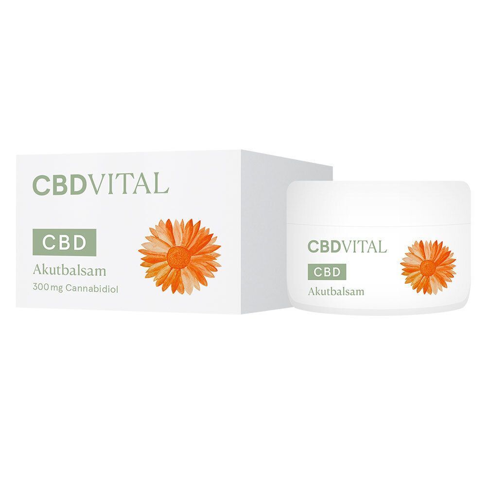 Weißer Tiegel und Schachtel mit CBDVITAL Akutbalsam. Aufschrift: CBD, Akutbalsam, und eine orangefarbene Blüte.