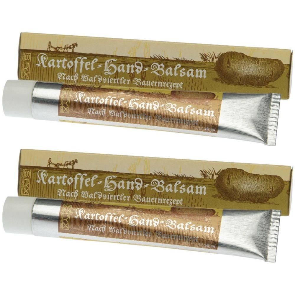 Zwei Tuben Handbalsam mit Kartoffel-Motiv und Kartonverpackung. Aufschrift: Kartoffel-Hand-Balsam. Bauernrezept.