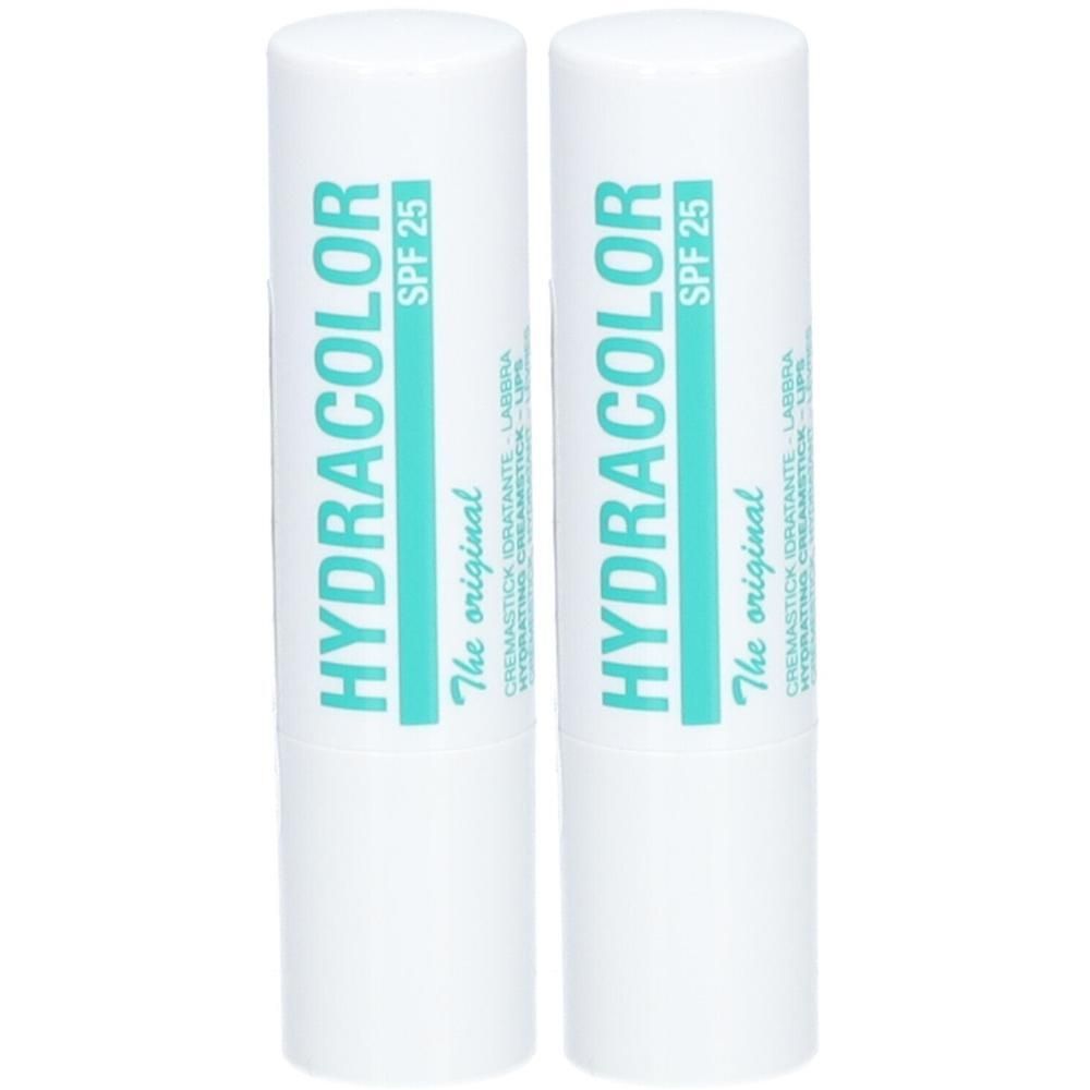 Zwei weiße Lippenpflegestifte mit türkisfarbener Schrift. Aufschrift: HYDRACOLOR, SPF 25, The original. Cremestick Idratante Labbra.