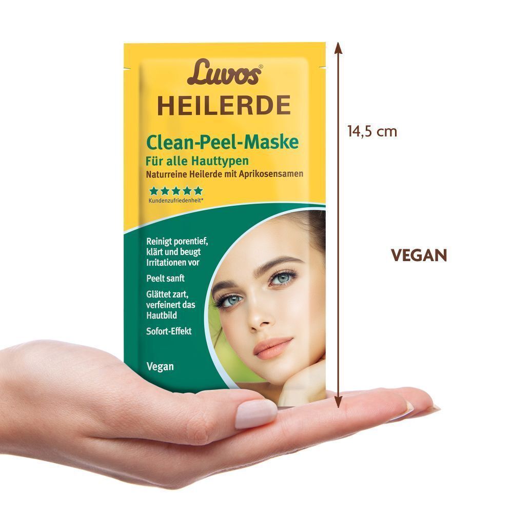 Gelber Beutel mit Produktaufdruck. Text: Luvos Heilerde Clean-Peel-Maske. Abbildung eines Gesichts. Vegan. Hand hält Beutel.