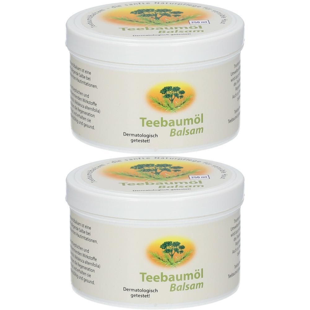 Zwei weiße Tiegel mit Deckel. Aufschrift: Teebaumöl Balsam. Auf dem Etikett ein Baum-Logo. Dermatologisch getestet.