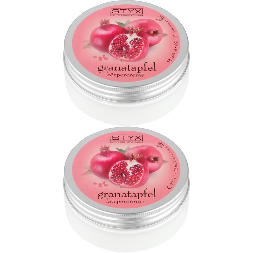 Zwei Tiegel Körpercreme mit Deckel. Aufschrift: Granatapfel Körpercreme. Abbildung: Granatäpfel. Marke: STYX.