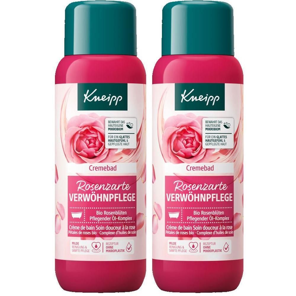 Zwei Flaschen Cremebad. Rosa Flaschen mit grünem Deckel. Aufdruck mit Rose und Text: Rosenzarte Verwöhnpflege.
