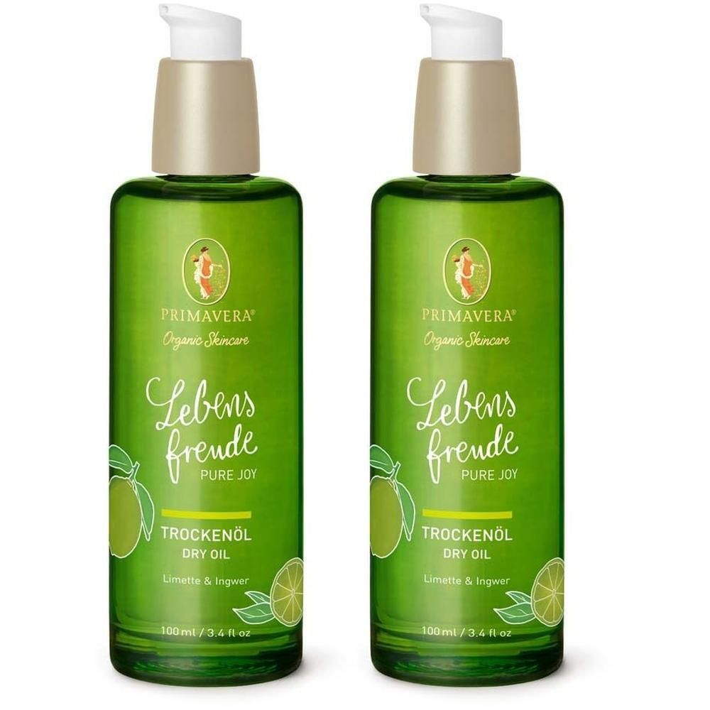 Zwei grüne Flaschen mit Pumpaufsatz. Aufschrift: Primavera, Lebensfreude, Trockenöl, Limette & Ingwer. 100 ml.