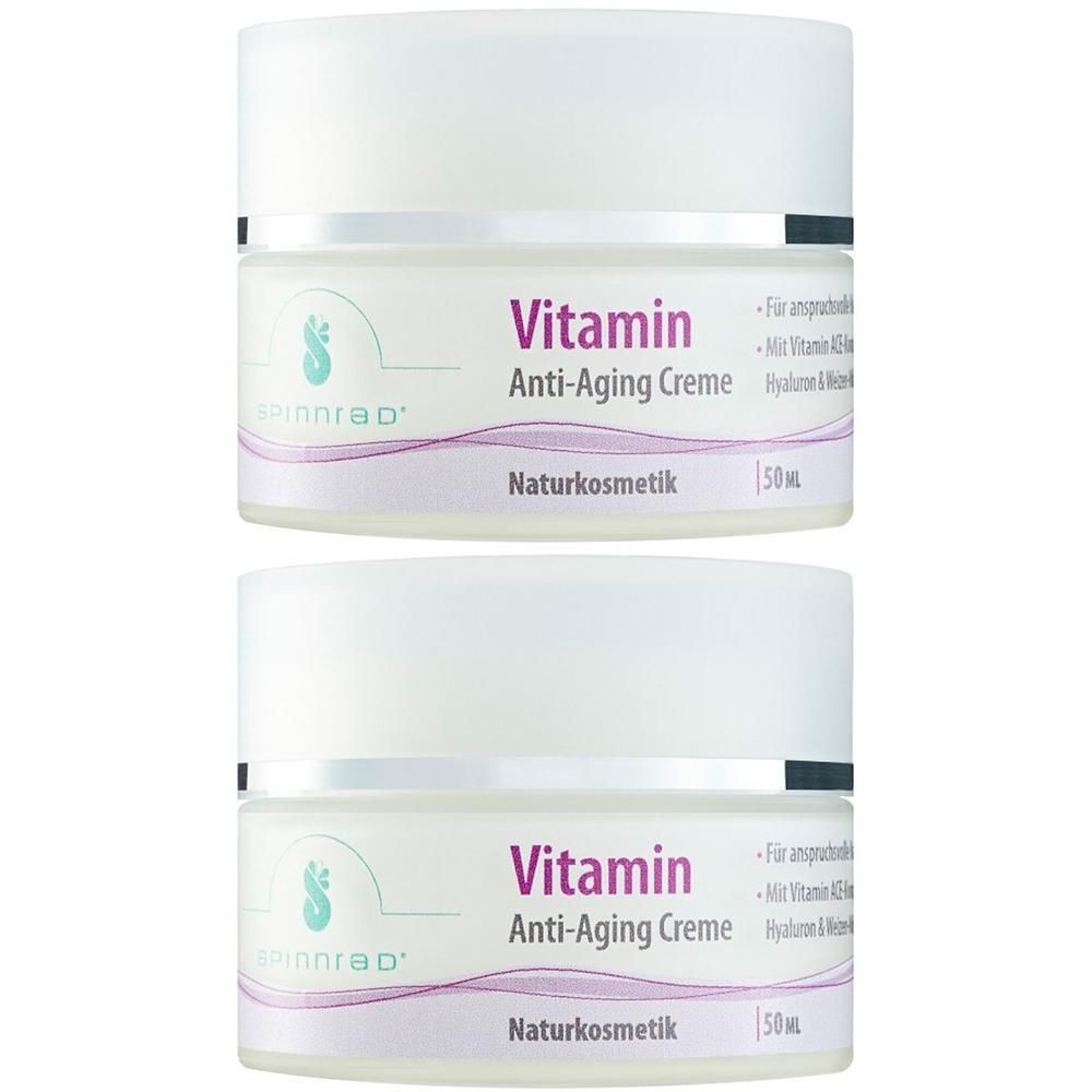 Zwei Tiegel Spinnrad® Vitamin Anti-Aging Creme. Weiße Tiegel mit Deckel, lila Schriftzug. Aufschrift: Vitamin Anti-Aging Creme, Naturkosmetik.