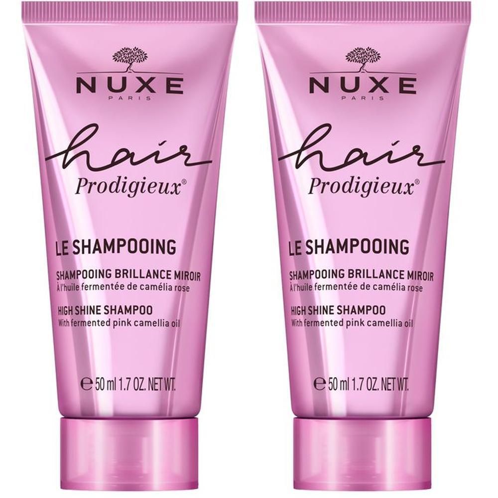 Zwei rosa Tuben Shampoo. Aufschrift: NUXE, Hair Prodigieux, Le Shampooing, High Shine Shampoo. Inhalt: 50 ml.