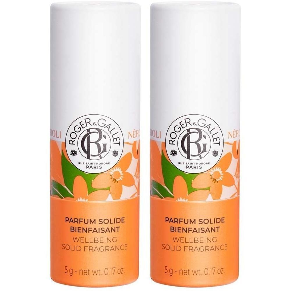 Zwei zylindrische Behälter. Weiß mit orangefarbenem Band, floralem Muster und Text. Marke Roger & Gallet. Aufschrift: Parfum solide bienfaisant.