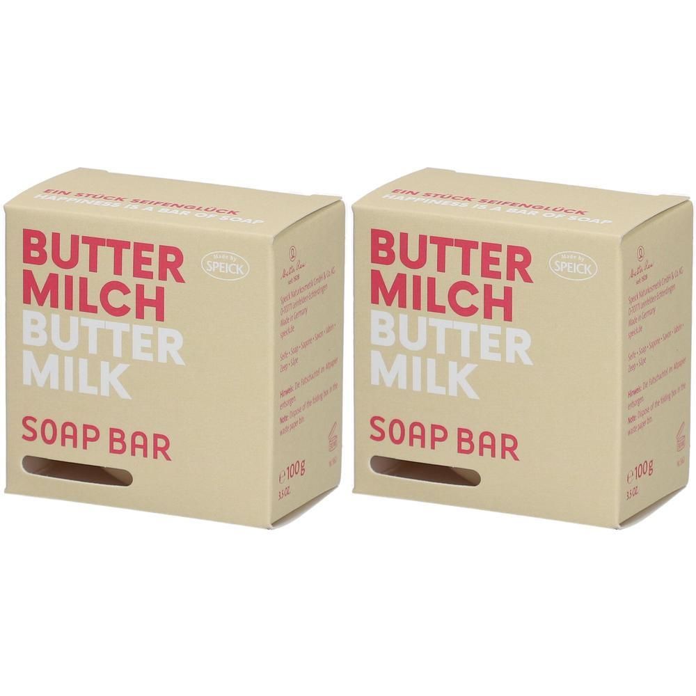 Zwei rechteckige Kartons mit Aufschrift BUTTER MILCH BUTTER MILK SOAP BAR. Marke Speick. Beige Verpackung mit roter und weißer Schrift.