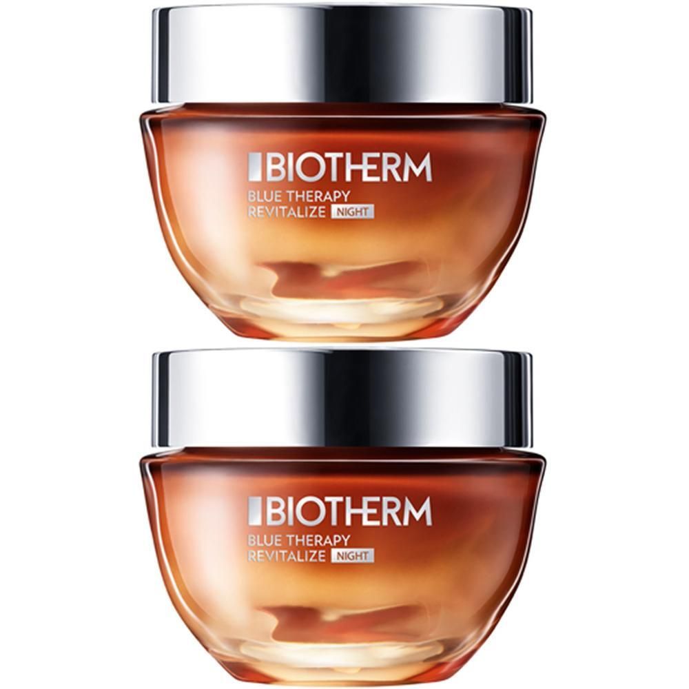 Zwei Tiegel BIOTHERM Blue Therapy Revitalize Night Nachtcreme. Glasbehälter mit silberfarbenen Deckeln. Orangefarbener Inhalt.