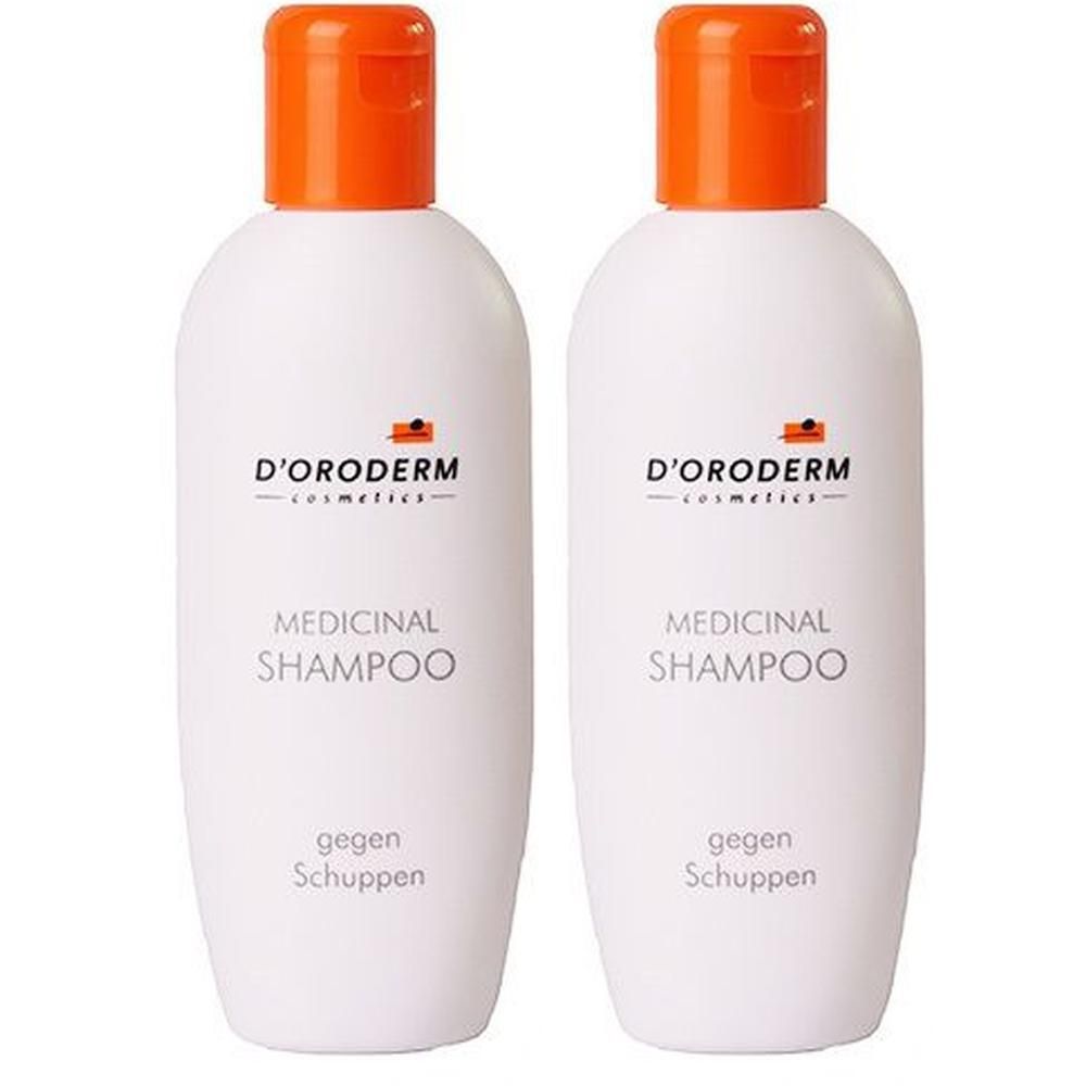 Zwei weiße Flaschen mit orangefarbenen Deckeln. Aufschrift: D'ORODERM, MEDICINAL SHAMPOO, gegen Schuppen.