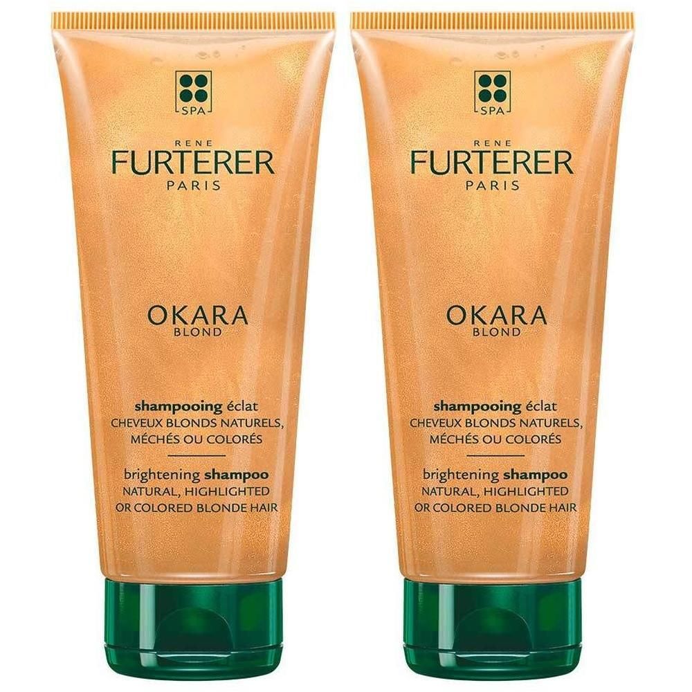 Zwei Tuben Shampoo. Goldfarbene Verpackung mit grünen Verschlüssen. Aufschrift: René Furterer Paris, Okara Blond, Shampooing éclat.