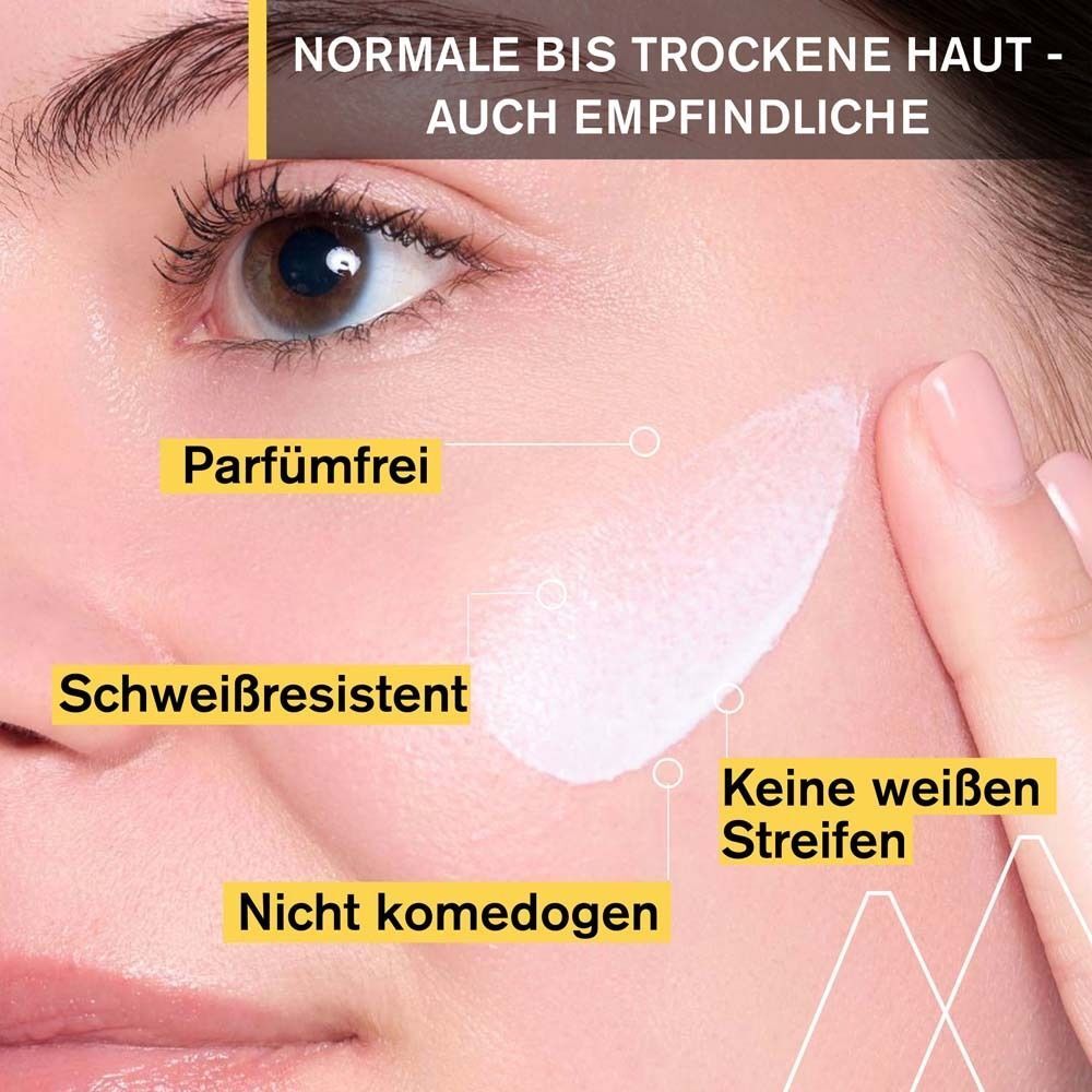 Nahaufnahme eines Gesichts mit Creme. Text: Parfümfrei, schweißresistent, nicht komedogen, keine weißen Streifen. Für normale bis trockene Haut.