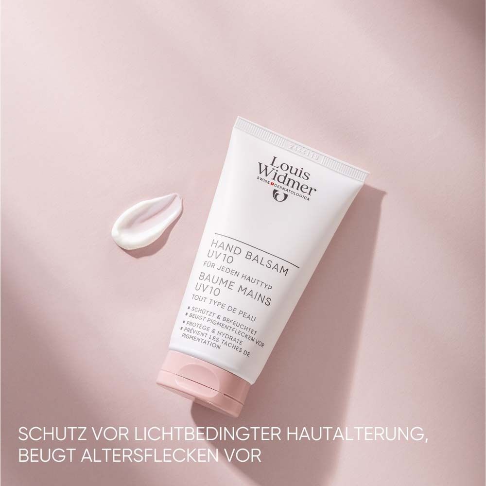 Tube Handbalsam UV10, weiß, rosa Verschluss. Klecks Creme daneben. Text: Louis Widmer, Hand Balsam, UV10, für jeden Hauttyp, Baume Mains UV10.