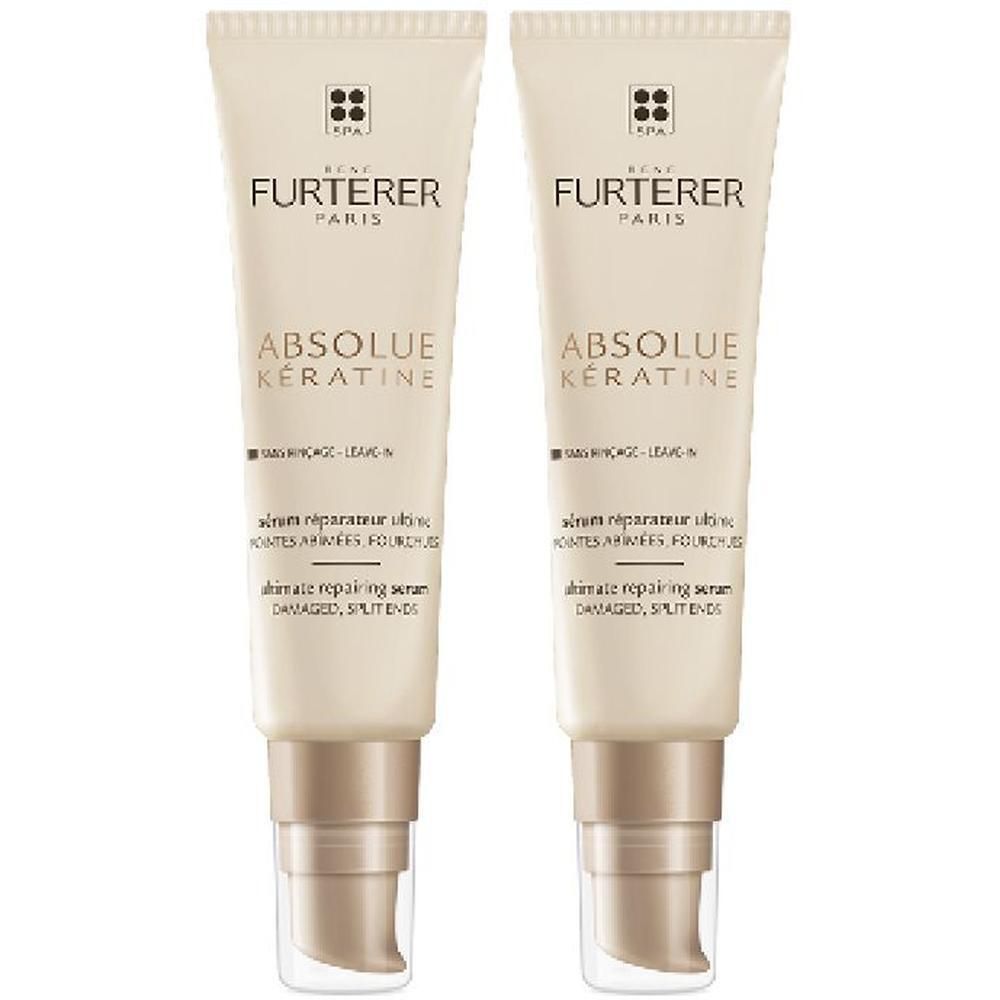 Zwei Tuben RENE FURTERER ABSOLUE KÉRATINE Ultimatives Repair Serum. Beige Tuben mit Pumpe, weißer Schrift und Logo.