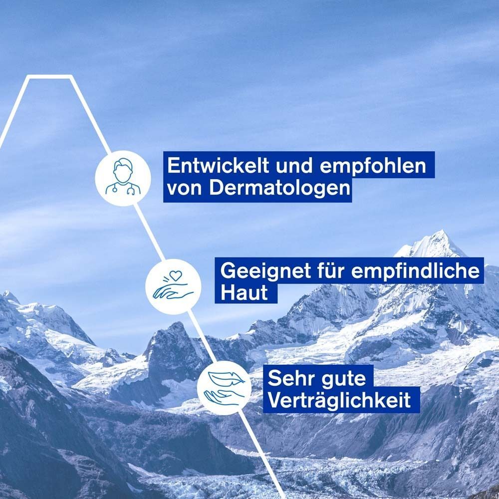 Text: Entwickelt und empfohlen von Dermatologen. Geeignet für empfindliche Haut. Sehr gute Verträglichkeit. Hintergrund: Berglandschaft.