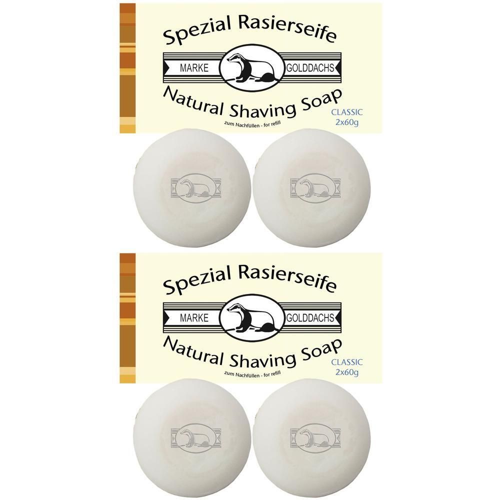 Zwei Packungen Rasierseife mit Logo und Schriftzug. Darunter vier runde Seifenstücke mit Logo. Aufschrift: GOLDDACHS Spezial Rasierseife.