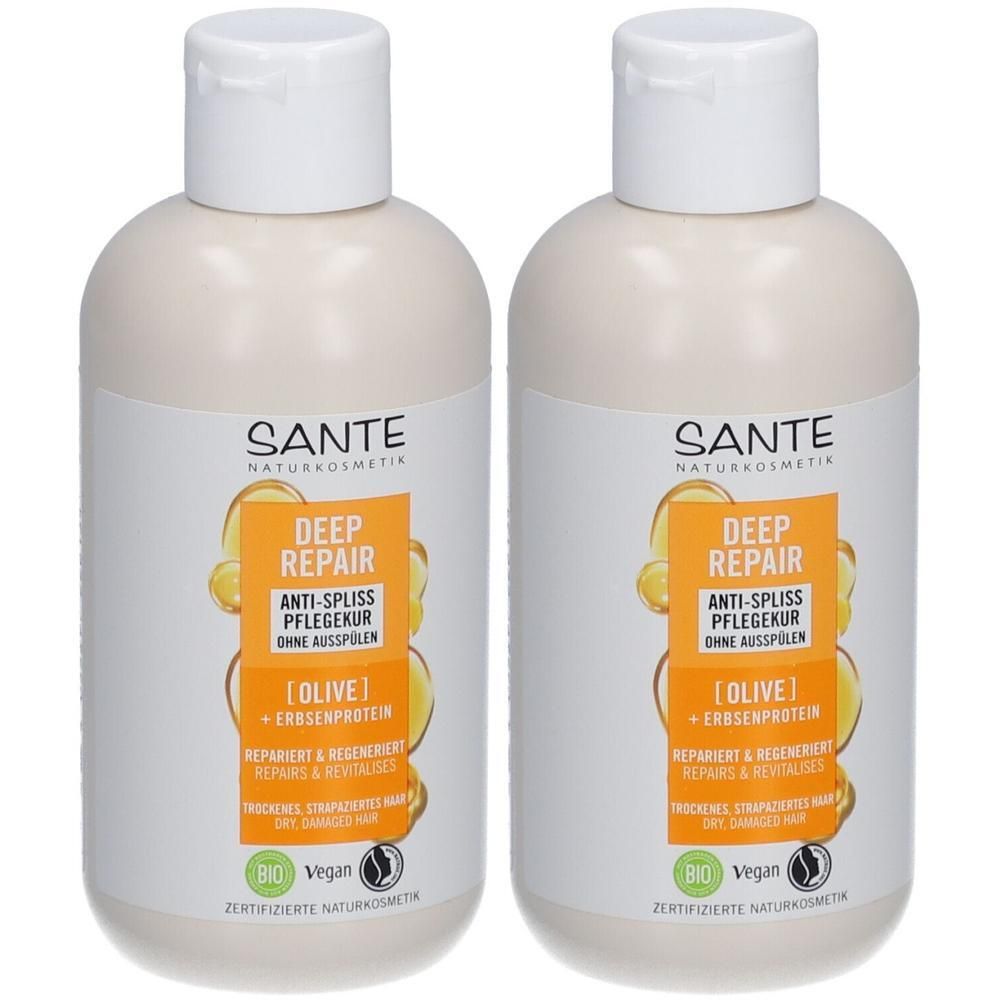 Zwei Flaschen SANTE Deep Repair Anti-Spliss Pflegekur. Weiße Flaschen mit weißen Deckeln und Etiketten mit Produktinformationen und Bio-Siegel.