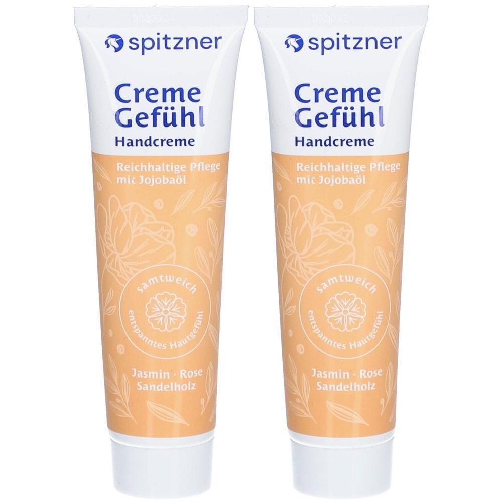 Zwei Tuben Handcreme. Aufschrift: Spitzner, Creme Gefühl, Handcreme. Beige-farbige Verpackung mit floralem Muster und Produktnamen.