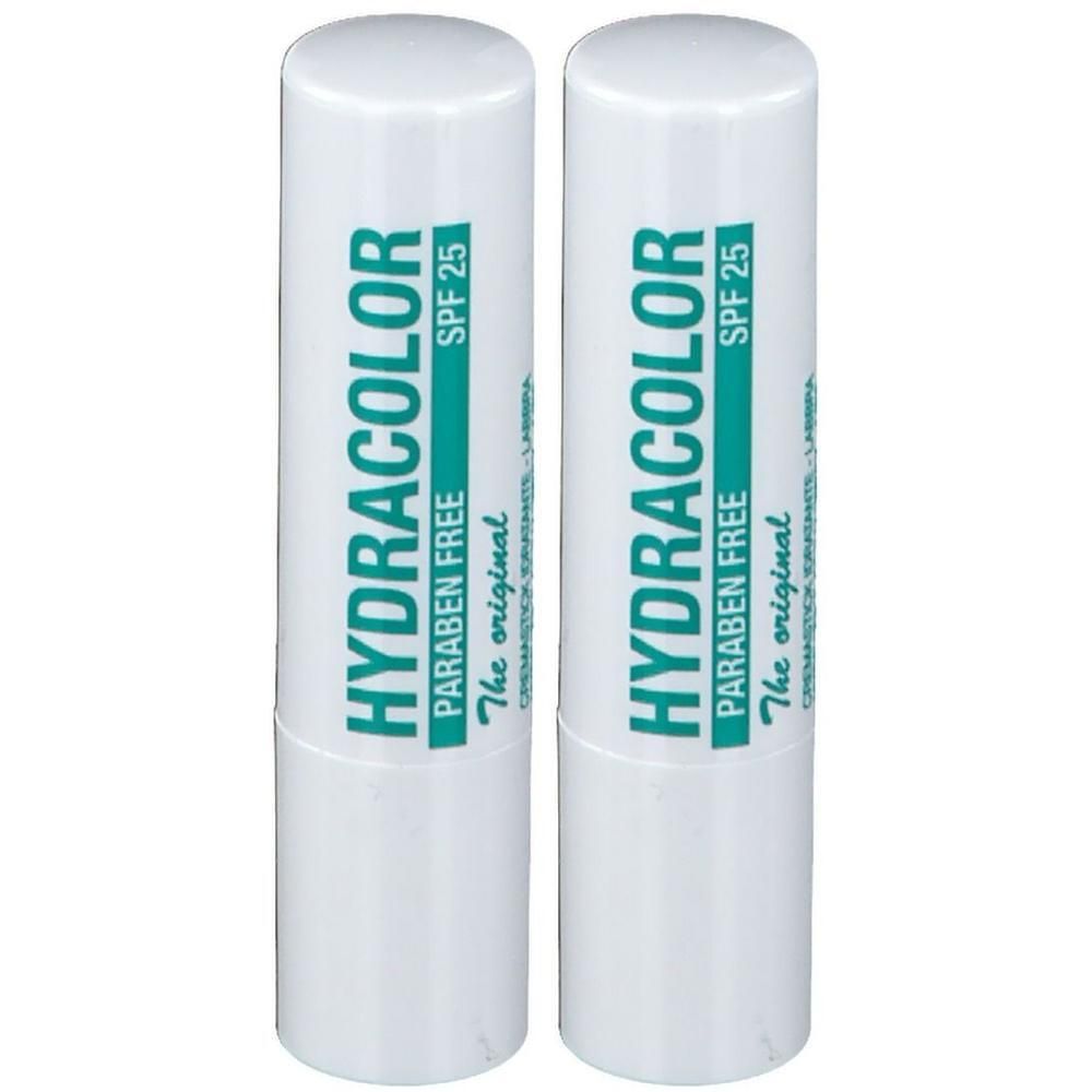 Zwei weiße Lippenpflegestifte mit grüner Schrift. Aufschrift: HYDRACOLOR, SPF 25, Paraben Free, The original.