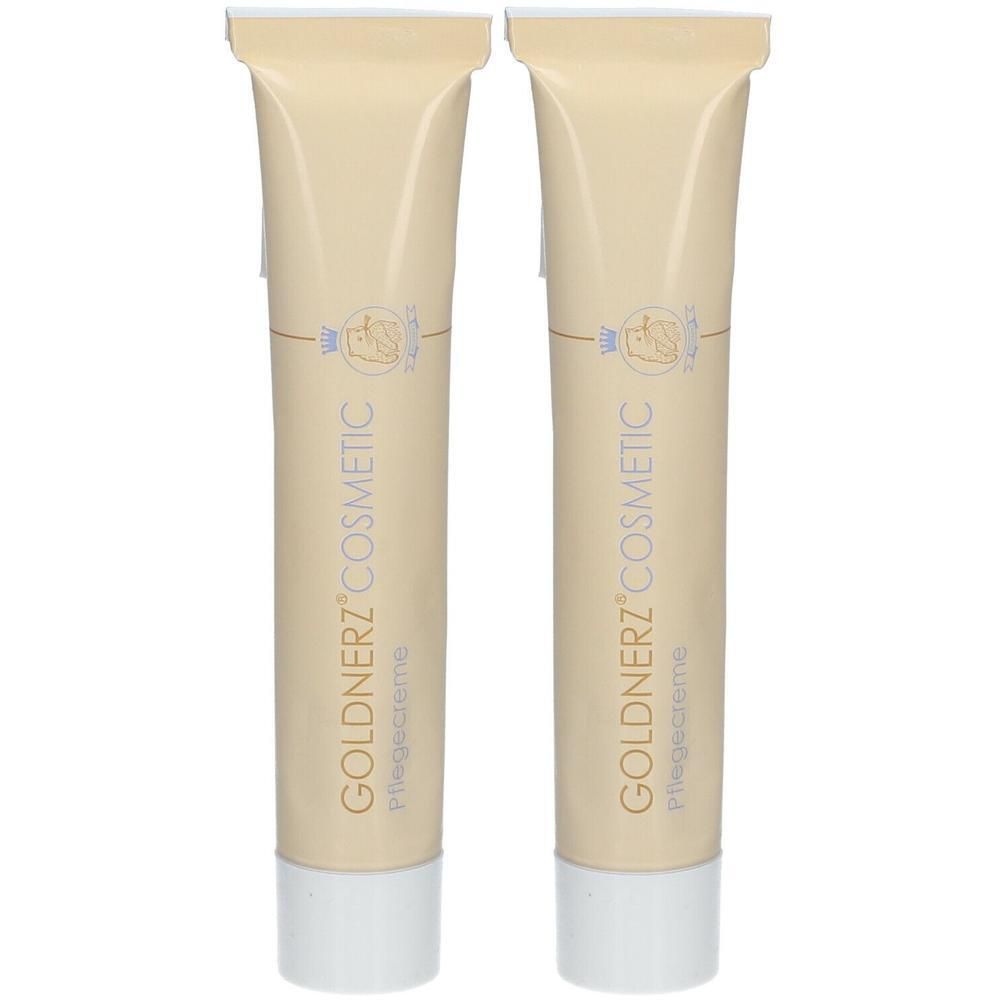 Zwei Tuben Pflegecreme. Beige Tuben mit weißem Verschluss. Aufdruck: GOLDNERZ COSMETIC, Pflegecreme.