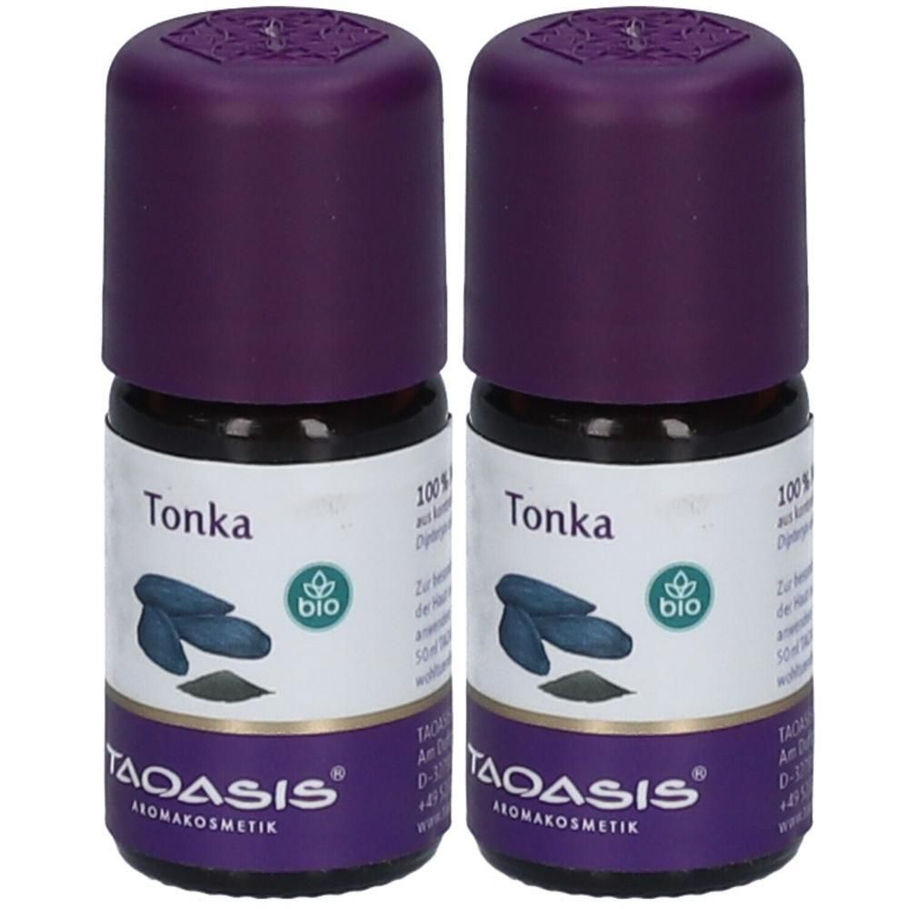 Zwei Flaschen mit lila Deckel. Aufschrift "Tonka" und "bio". Marke TAOASIS®. Aromakosmetik. Aufkleber mit Abbildung von Bohnen.