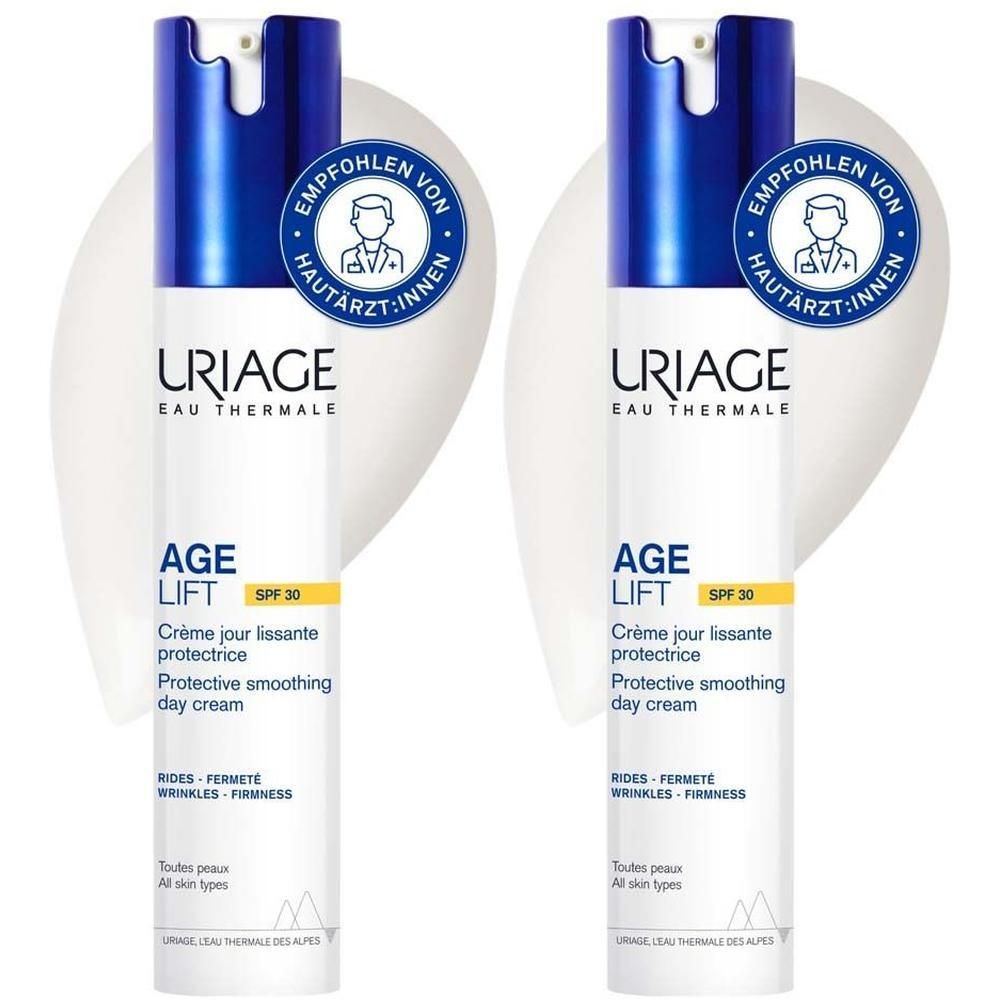 Zwei weiße Flaschen mit blauen Kappen. Aufschrift: URIAGE Age Lift LSF 30. Empfohlen von Hautärzt:innen.