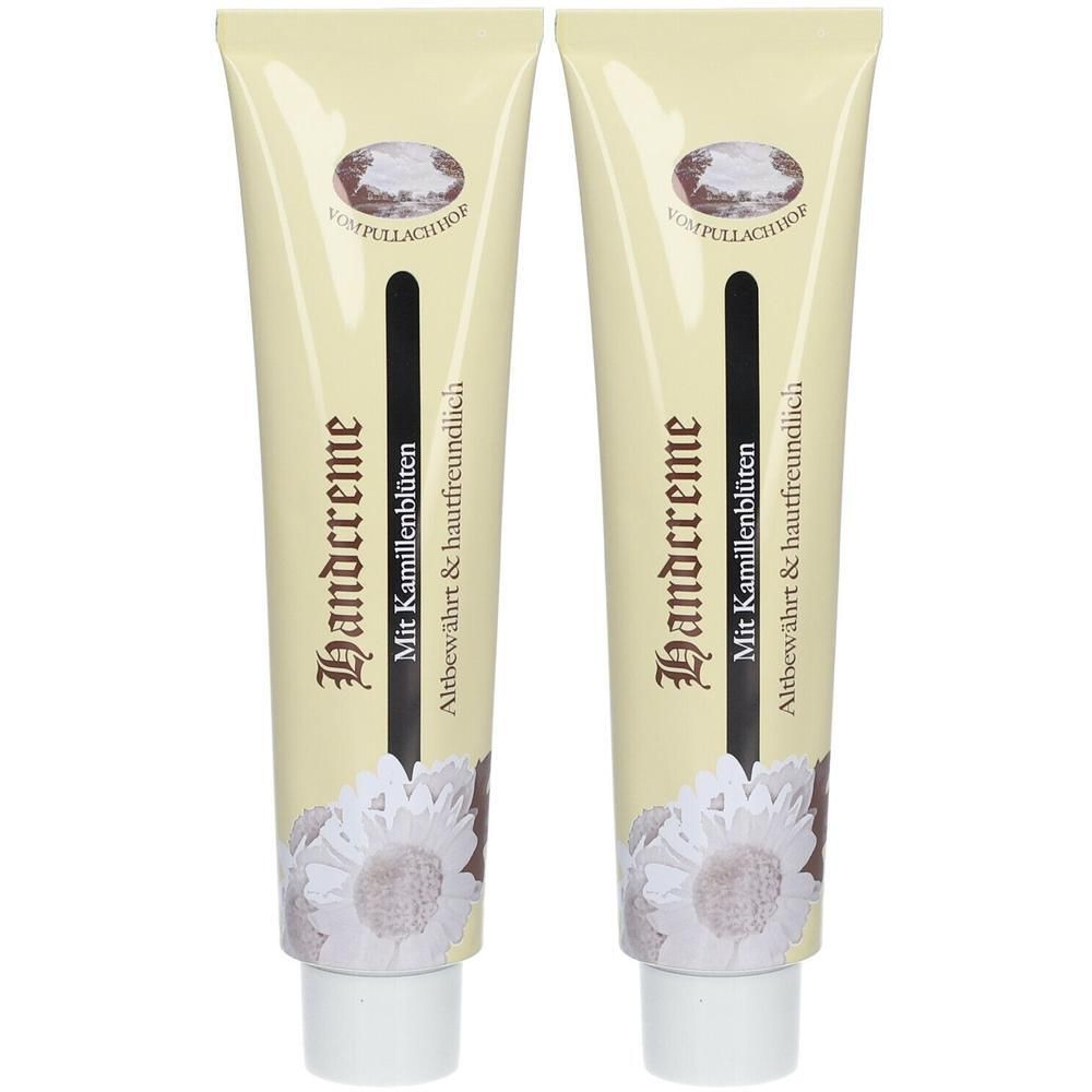 Zwei Tuben Handcreme mit Kamillenblüten. Beige Tuben mit schwarzem Streifen und floralem Design. Text: Handcreme.