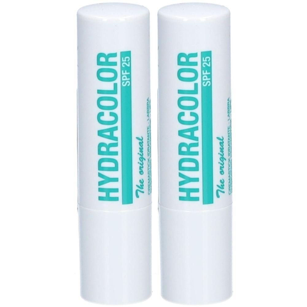 Zwei weiße Lippenpflegestifte mit türkisfarbener Beschriftung. Aufschrift: HYDRACOLOR SPF 25. "The original".