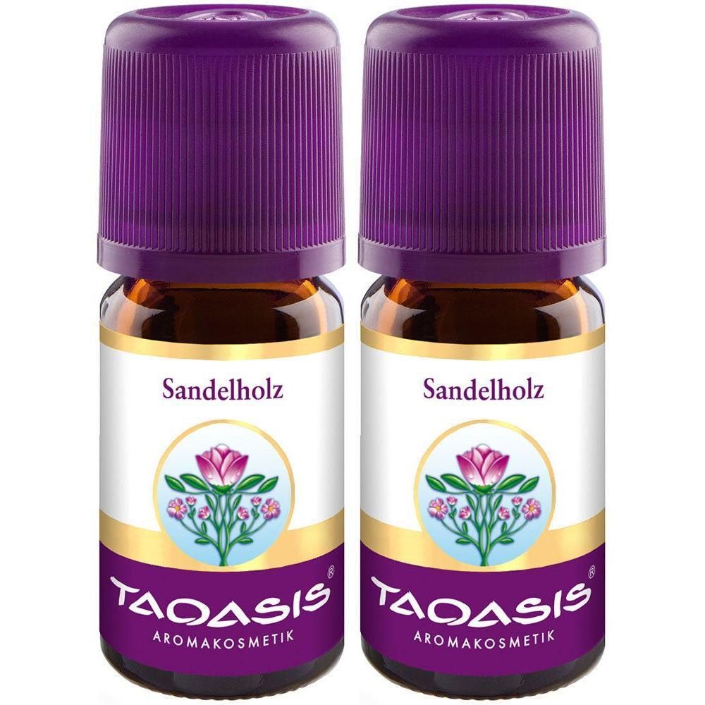 Zwei kleine Glasflaschen mit brauner Flüssigkeit und lila Deckeln. Auf den Etiketten steht "Sandelholz" und "TAOASIS Aromakosmetik".