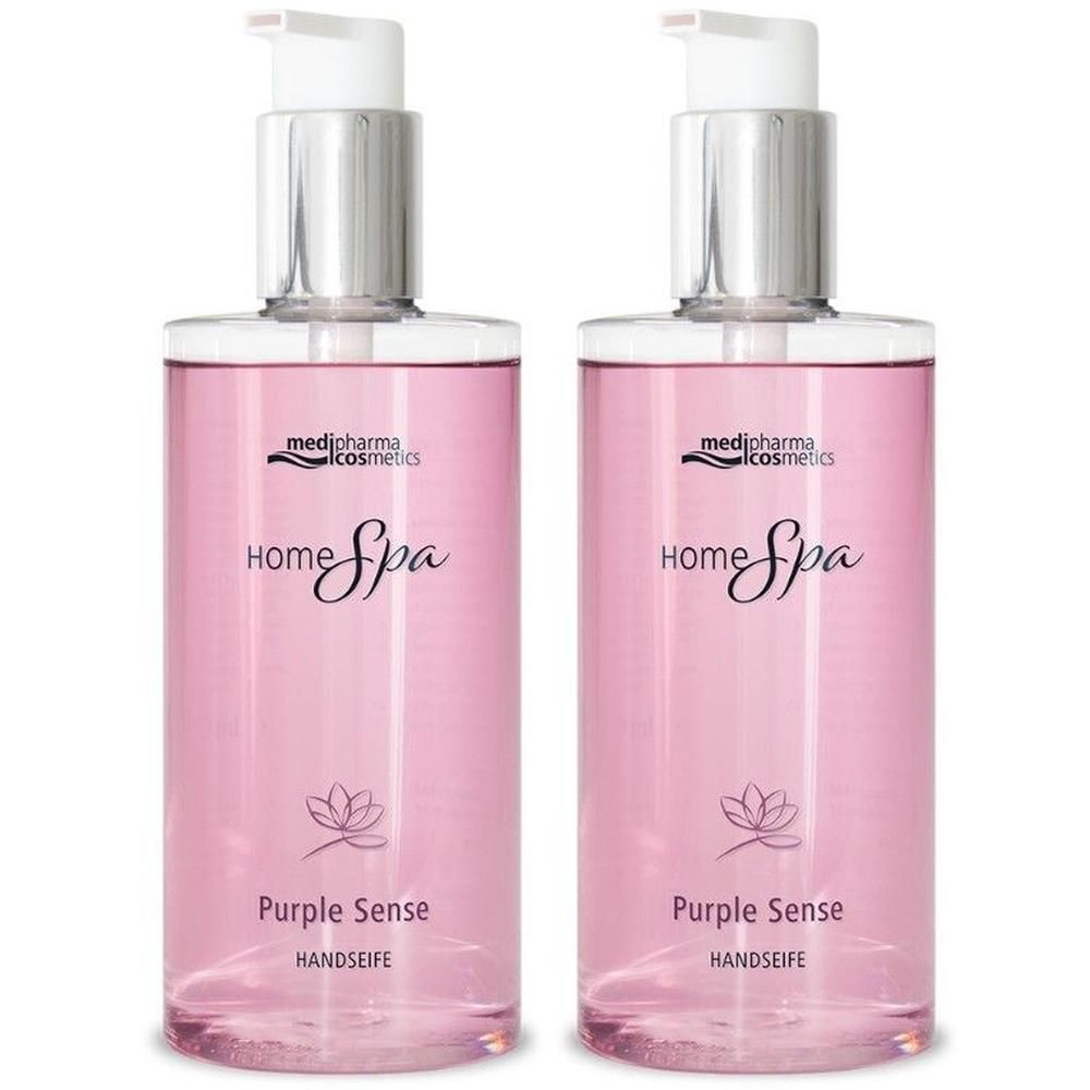 Zwei Flaschen HOME SPA Purple Sense Handseife. Runde, transparente Flaschen mit Pumpaufsatz. Lila Flüssigkeit sichtbar.
