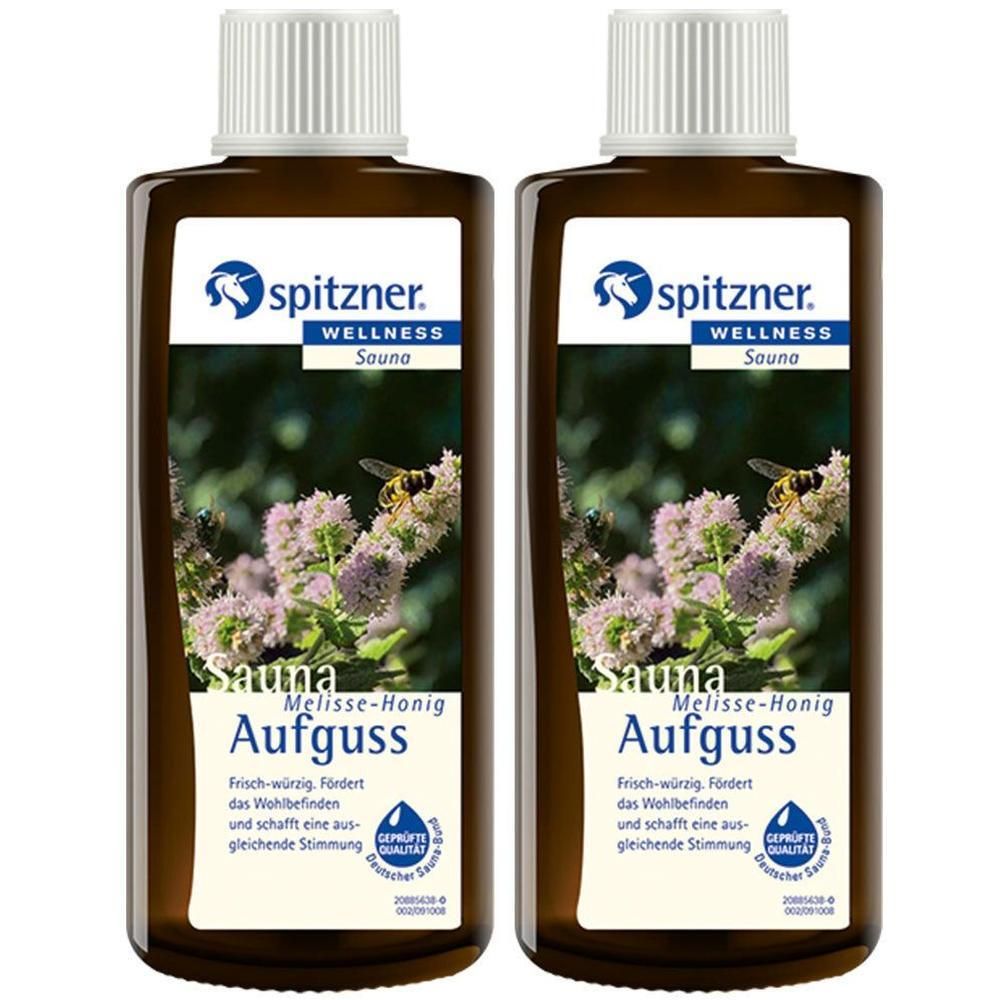 Zwei braune Flaschen mit weißem Deckel. Auf dem Etikett steht "spitzner. WELLNESS Sauna Aufguss Melisse-Honig".