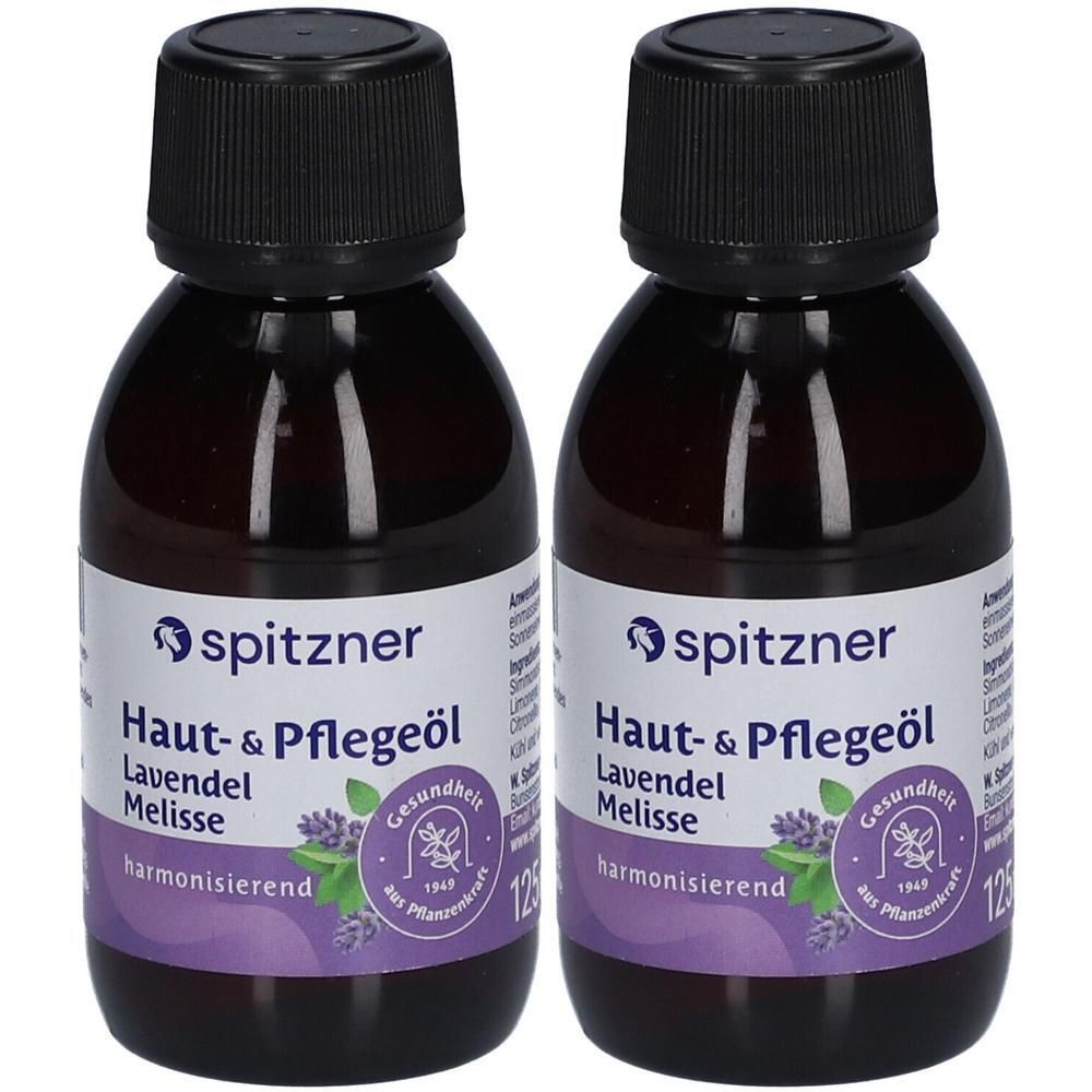 Zwei Flaschen Haut- und Pflegeöl mit schwarzen Schraubverschlüssen. Etiketten mit Produktnamen und Logo. Lavendel und Melisse.
