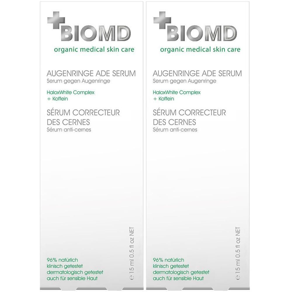 Zwei Packungen BioMD Augenringe ade Serum. Weiße Verpackung mit grüner Schrift. Text: Augenringe ade Serum, 15 ml.