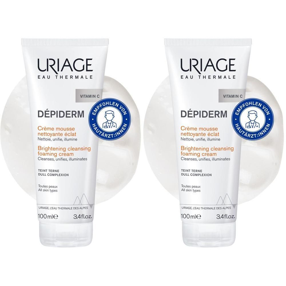 Zwei Tuben Uriage Dépiderm Reinigungsschaum. Weiß, mit blauer und orangefarbener Schrift. Dermatologisch getestet.