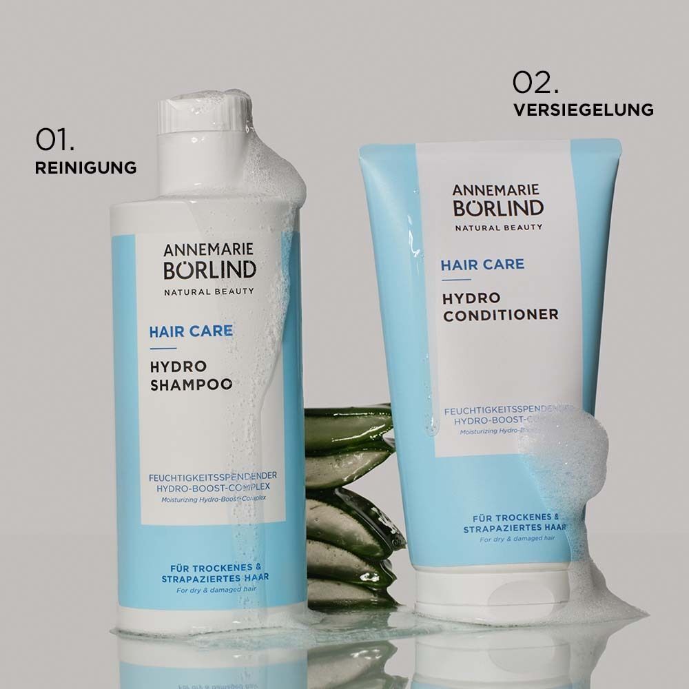 Shampoo und Conditioner. Schaum. Text: Annemarie Börlind. Hellblaue Verpackung.