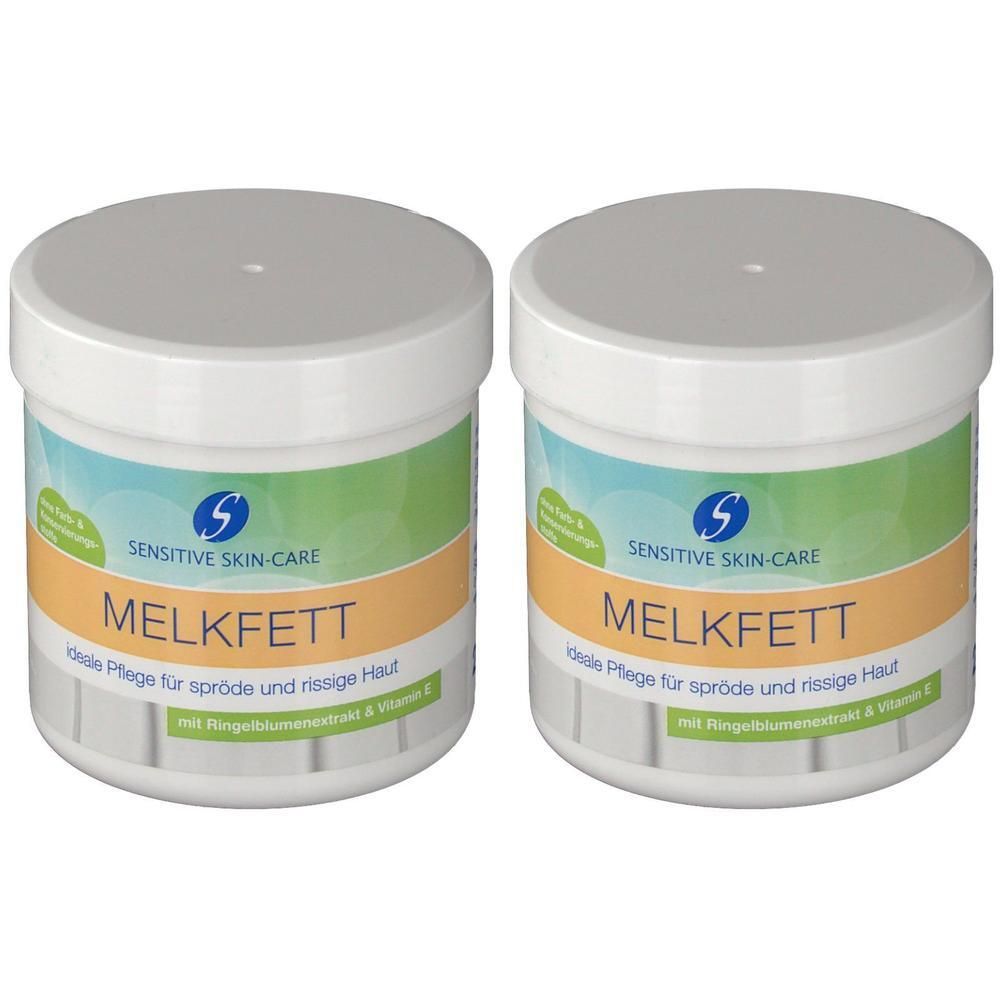 Zwei weiße Tiegel mit Deckel. Aufschrift: SENSITIVE SKIN-CARE MELKFETT. Orangefarbener Streifen mit Text. Blaue und grüne Elemente.