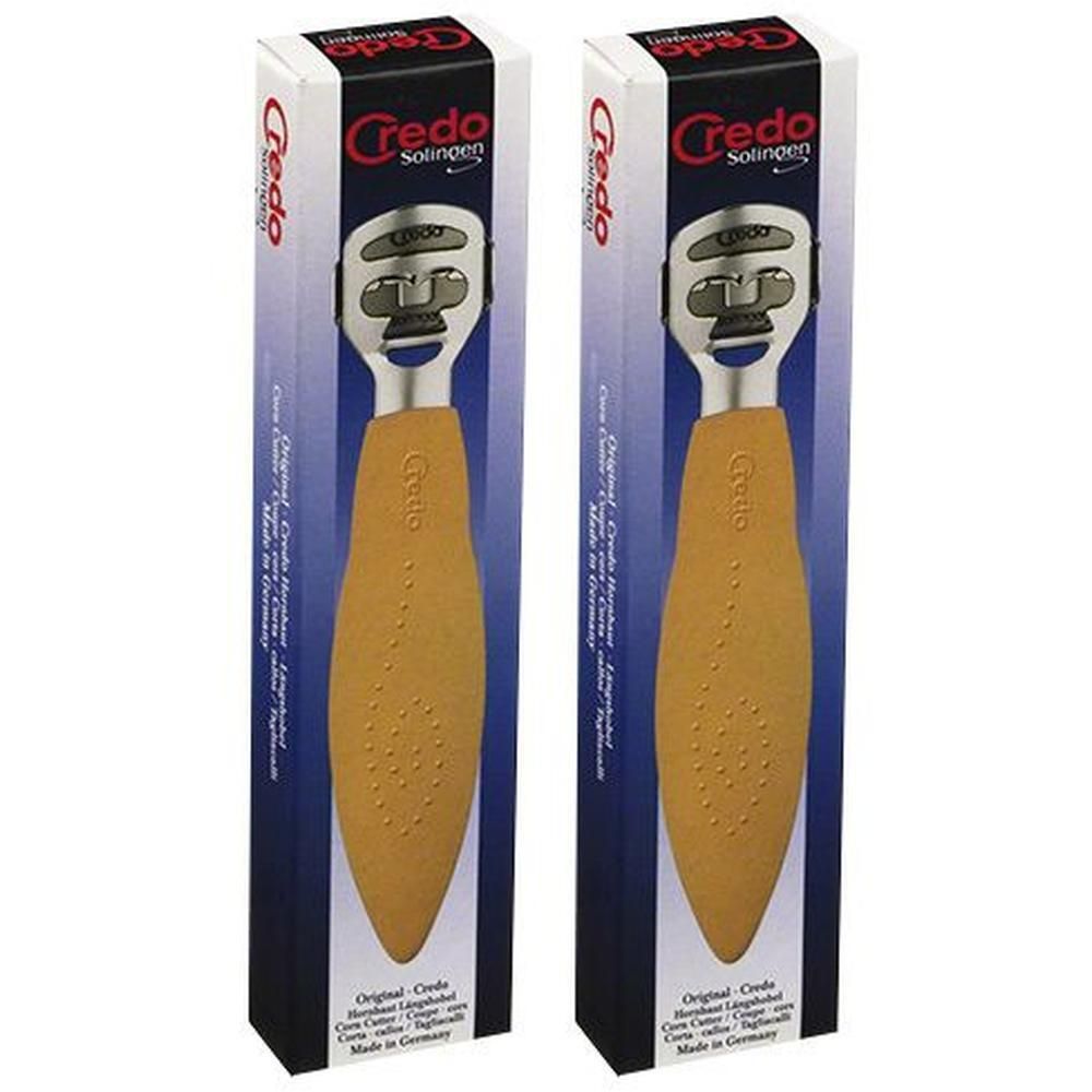 Zwei Credo Hornhauthobel in Verpackung. Der Griff ist gelb, der Kopf silberfarben. Auf der Verpackung steht Credo Solingen.