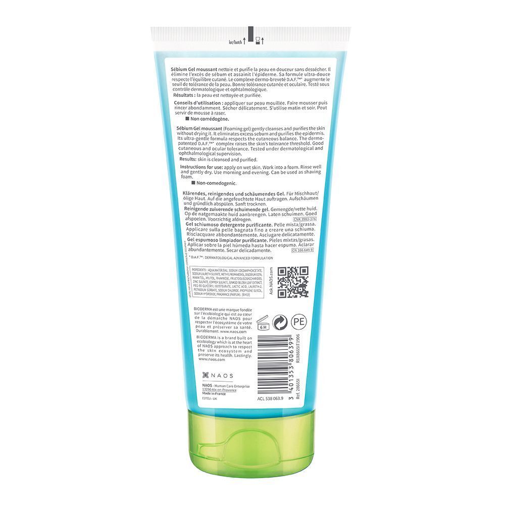 Rückseite einer blauen Tube. Text in mehreren Sprachen. Grüner Verschluss.