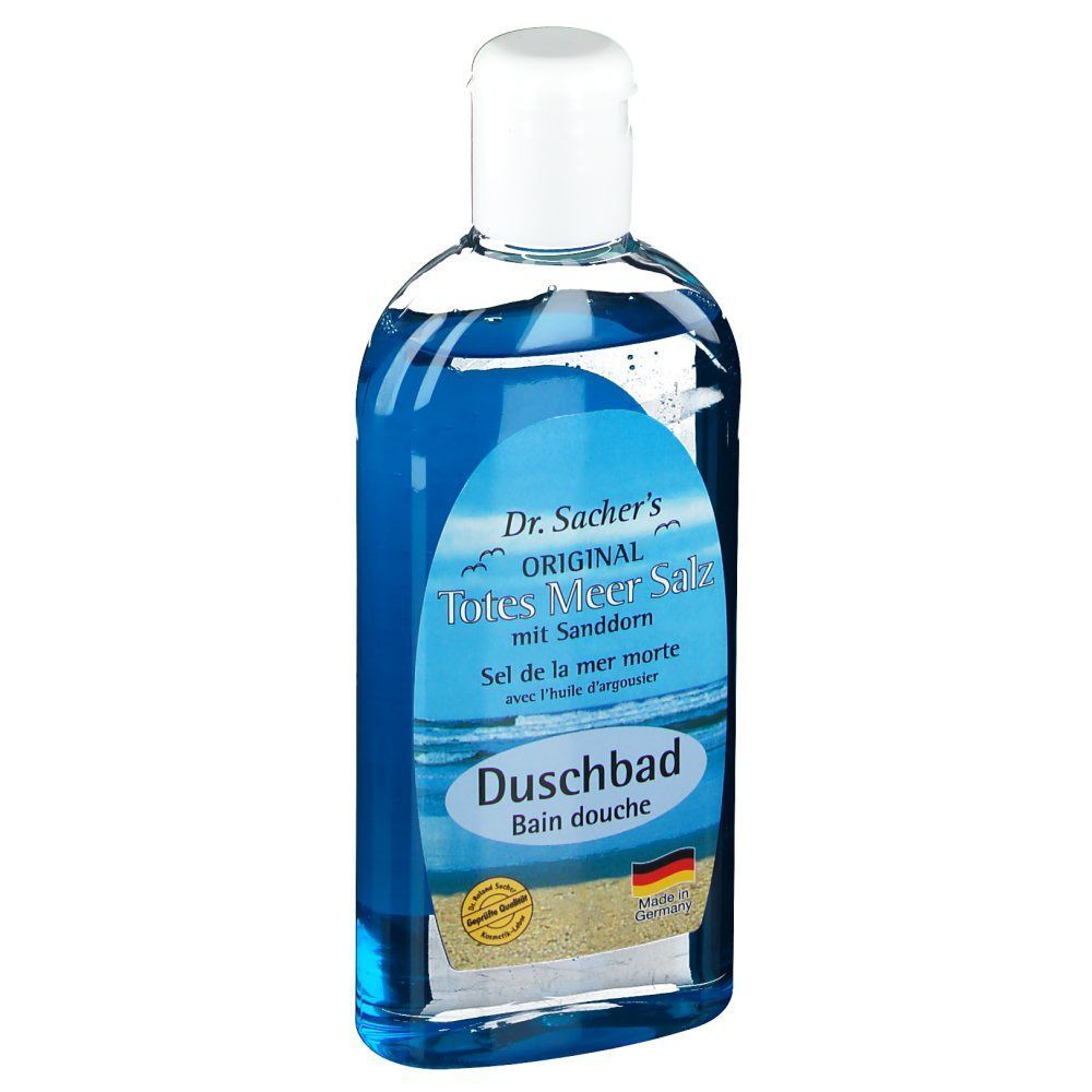 Eine Flasche Duschbad mit blauem Inhalt. Aufschrift: Dr. Sacher's Original Totes Meer Salz mit Sanddorn. Mit weißem Deckel und Etikett.