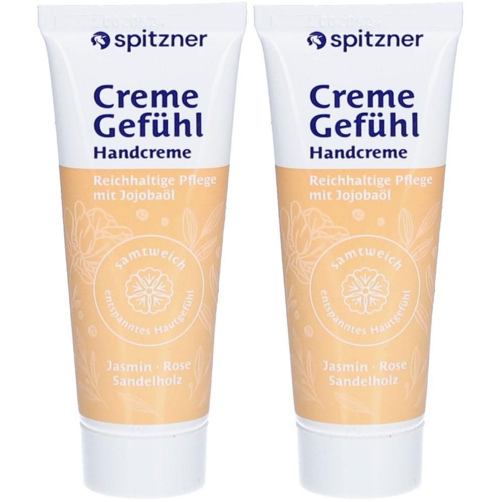 Zwei Tuben Handcreme. Weiß-beige Verpackung mit Produktnamen und Inhaltsstoffen. Marke: Spitzner.