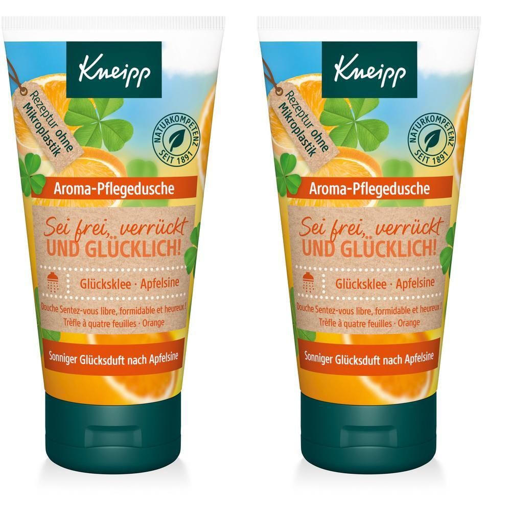 Zwei Tuben Aroma-Pflegedusche. Grün-weiße Tuben mit Produktnamen und Kleeblatt-Motiv. Text: "Sei frei, verrückt und glücklich!" und "Glücksklee-Apfelsine".