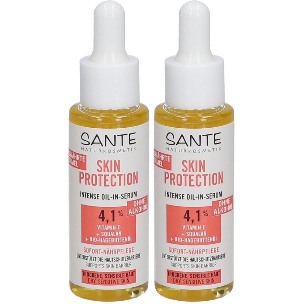 Zwei Flaschen Öl-in-Serum. Aufschrift: SKIN PROTECTION, INTENSE OIL-IN-SERUM, 4,1%, Vitamin E, Squalane, Bio-Hagebuttenöl. Für trockene, sensible Haut.