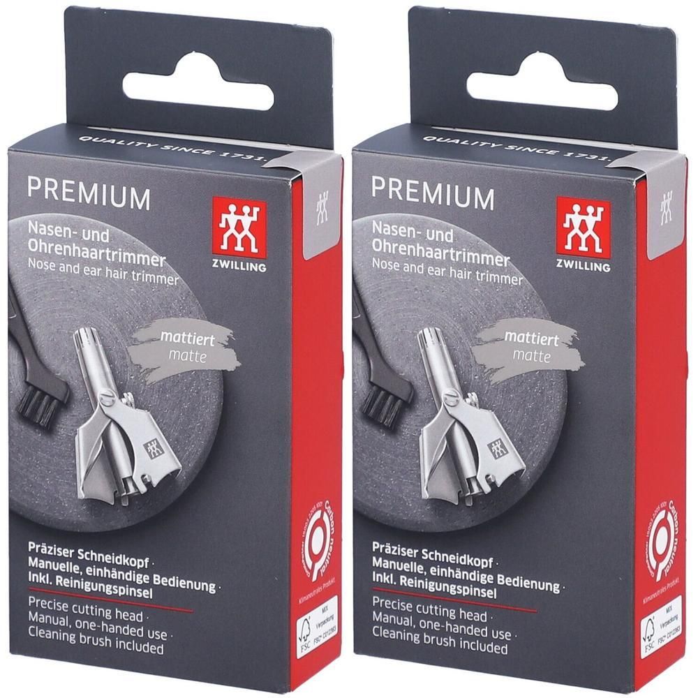 Zwei Produktverpackungen. Aufschrift: PREMIUM Nasen- und Ohrenhaartrimmer. Enthält einen Präzisions-Schneidkopf, manuelle Bedienung und einen Reinigungspinsel.