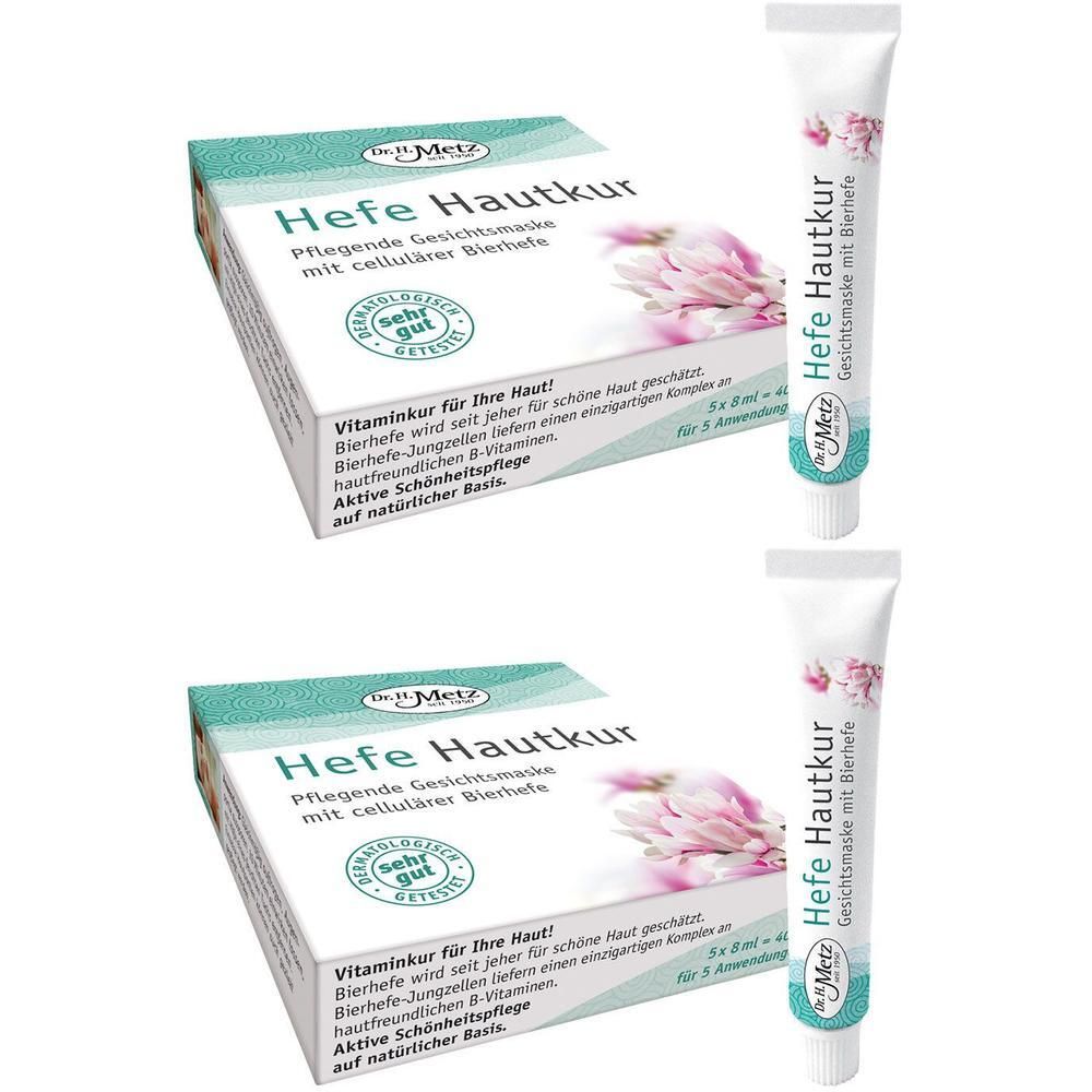 Zwei Packungen und zwei Tuben Gesichtsmaske. Aufschrift: Hefe Hautkur. Verpackung mit floralem Design und Text. Tuben mit floralem Design.