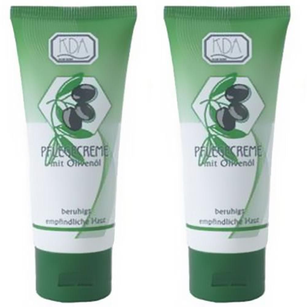Zwei Tuben KDA® Pflegecreme mit Olivenöl. Grün-weißes Design mit Oliven-Illustration und Schriftzug. Beruhigt empfindliche Haut.